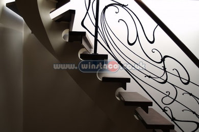 Staircase - contemporary staircase idea in Other