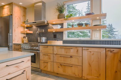 Open concept kitchen - large rustic l-shaped porcelain tile open concept kitchen idea in Other with an undermount sink, shaker cabinets, light wood cabinets, quartz countertops, black backsplash, ceramic backsplash, stainless steel appliances and an island