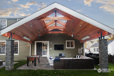 Inspiration for a mid-sized backyard concrete covered patio remodel in St Louis