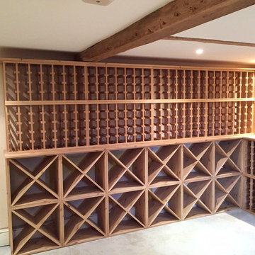 Large wine room using solid pine racking in Hampshire