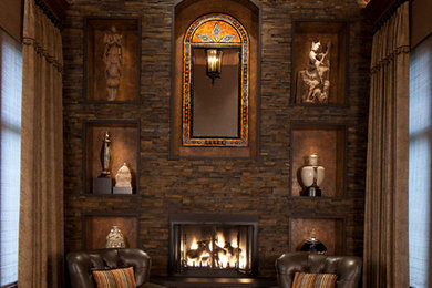Inspiration for a traditional family room in Chicago with a stone fireplace surround.