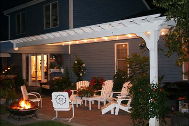 Photo of a large contemporary backyard verandah in Other with a pergola.