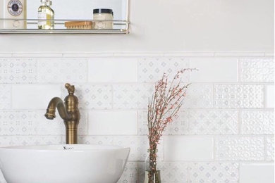 Example of a mid-sized trendy white tile powder room design in Cleveland with furniture-like cabinets, dark wood cabinets, white walls, a vessel sink and wood countertops