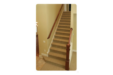 Staircase - mid-sized carpeted straight staircase idea in Grand Rapids