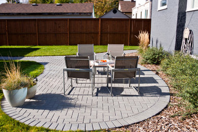 Example of a small classic backyard brick patio container garden design in Other with no cover