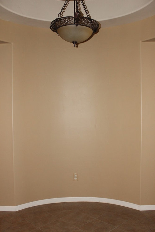 Curved foyer wall. Need help decorating.