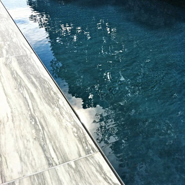 perimeter overflow pool + marble decking