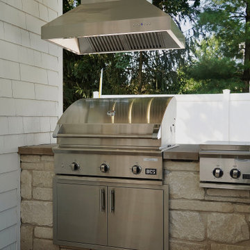 Built-In Outdoor Kitchen with DCS Grill & Limestone Countertops