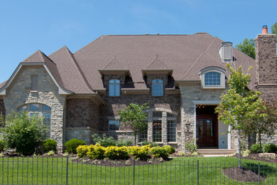 Huge two-story brick exterior home idea in St Louis