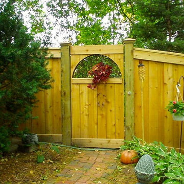 Custom Fence project with repurposed floor grate as gate window in Lincoln, NE