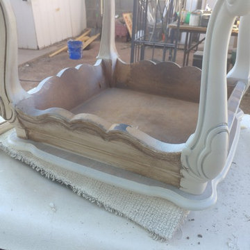 Distressed ottoman base coated and starting a glaze