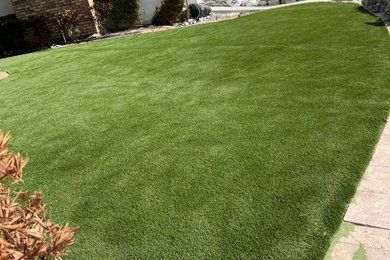 Design ideas for a large full sun backyard landscaping in Other.