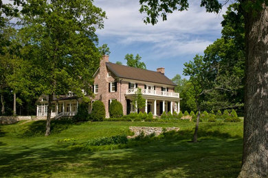 Inspiration for a large timeless two-story brick exterior home remodel in DC Metro
