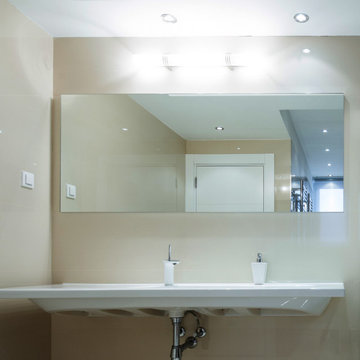 Modern Bathroom with Rolling Shower Doors and Vanity Mirror