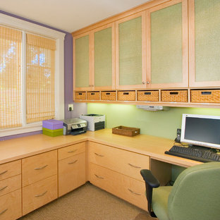 Design ideas for a large modern study in San Francisco with green walls, a built-in desk, carpet, no fireplace and beige floors.