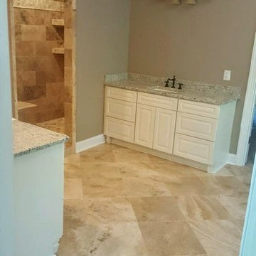 Philadelphia Travertine and D'argento marble bathrooms