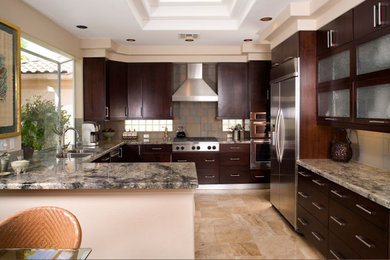 Inspiration for a mid-sized contemporary l-shaped travertine floor, beige floor and vaulted ceiling eat-in kitchen remodel with a double-bowl sink, flat-panel cabinets, dark wood cabinets, granite countertops, multicolored backsplash, glass tile backsplash, stainless steel appliances, an island and green countertops