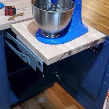 Blue Kitchen with Honey Pecan Flooring, Granite and butcher block counters