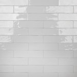 Merola Tile - Chester Bianco Ceramic Wall Tile - Offering a subway look, our Chester Bianco Ceramic Wall Tile features a smooth, glossy finish, providing decorative appeal that adapts to a variety of stylistic contexts. With its semi-vitreous features, this white rectangle tile is an ideal selection for indoor commercial and residential installations, including kitchens, bathrooms, backsplashes, showers, hallways and fireplace facades. This tile is a perfect choice on its own or paired with other products in the Chester Collection. Tile is the better choice for your space!