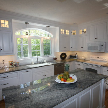 Custom White Kitchen with Scottish Meadow Granite tops