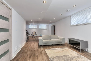 Basement - modern basement idea in Toronto