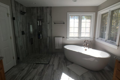 Bathroom - mid-sized transitional master porcelain tile bathroom idea in Bridgeport with a hinged shower door