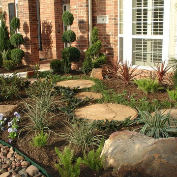 Landscaping with oversize pavers and backyard creek - hkns