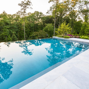 Luxury vanishing edge swimming pool and outdoor living area Ridgewood NJ
