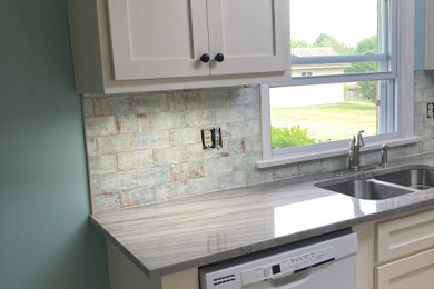 Inspiration for a kitchen remodel in Other with shaker cabinets, white cabinets, granite countertops, blue backsplash, ceramic backsplash and gray countertops