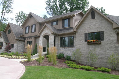 Large traditional gray two-story mixed siding exterior home idea in Chicago with a shingle roof