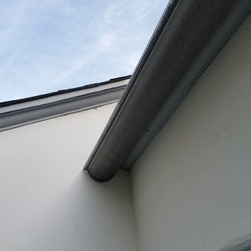 Bonderized Steel, 5 inch Half Round Seamless Gutters with Round Downspouts.