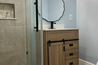 Inspiration for a gray tile and ceramic tile single-sink bathroom remodel in Denver with shaker cabinets, beige cabinets, quartz countertops and white countertops