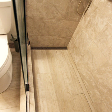 Beige Tiled Shower and Free Standing Vanity with Quartz Countertop