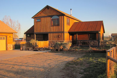 Example of a large mountain style beige two-story mixed siding exterior home design in Albuquerque with a metal roof