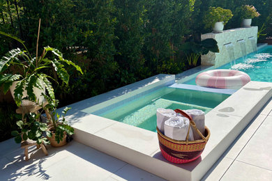 Pool - contemporary backyard pool idea in Orange County