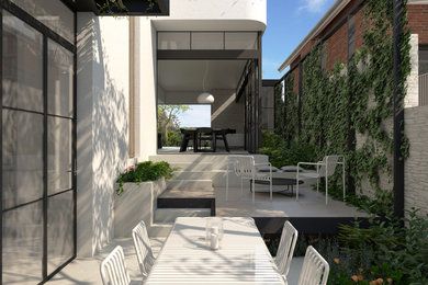 Contemporary courtyard patio in Perth with decking and an awning.