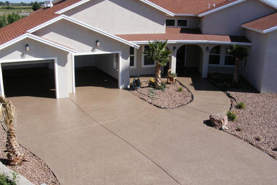 Photo of a large traditional one-storey stucco beige house exterior in Minneapolis with a gable roof and a shingle roof.