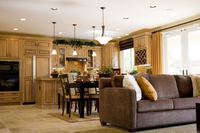Inspiration for a mid-sized timeless l-shaped ceramic tile and beige floor open concept kitchen remodel in Los Angeles with raised-panel cabinets, medium tone wood cabinets, granite countertops, brown backsplash, mosaic tile backsplash, black appliances and an island