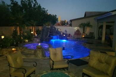 Inspiration for a mid-sized mediterranean backyard stone and kidney-shaped pool remodel in San Diego