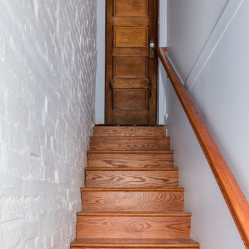 New stair well and traditional door heading back up to Kitchen and First Floor