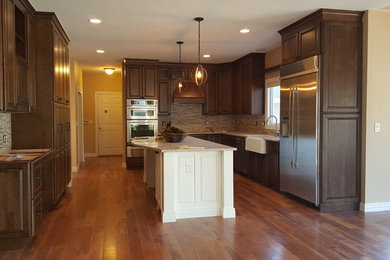 Example of a transitional kitchen design in Denver