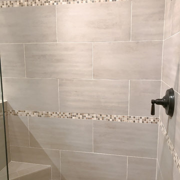 Custom bathroom remodel with Walk in shower and jet tub with grey tile surround