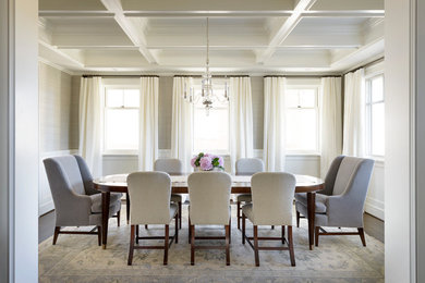 This is an example of an expansive traditional separate dining room in Seattle with grey walls and dark hardwood floors.