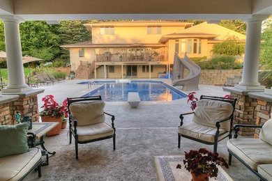 Inspiration for a large contemporary backyard concrete and l-shaped aboveground pool house remodel in Cedar Rapids
