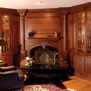 Inspiration for a traditional home office in New York with medium hardwood floors and a corner fireplace.