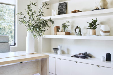 Mid-sized transitional freestanding desk terra-cotta tile home office photo in Los Angeles with white walls