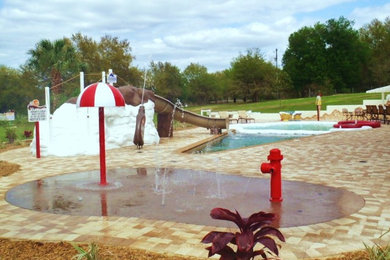 Patio fountain - mid-sized tropical backyard concrete paver patio fountain idea in Phoenix with no cover