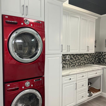 Laundry Room design with extra dryer and maximized storage space
