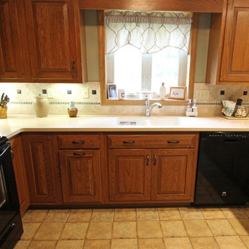 Tile Backsplash with Glass Accents and Oil Rubbed Bronze Cast Metal Tiles