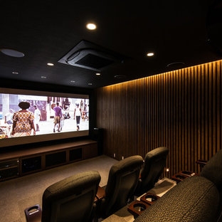 Photo of a large modern enclosed home cinema in Kyoto with brown walls, ceramic flooring, a projector screen and grey floors.